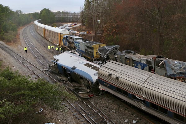 Authorities investigate the scene of a fatal Amtrak train crash in Cayce, S.C., Sunday, Feb. 4, 2018. At least two were killed and dozens were injured. (Tim Dominick/The State via AP)