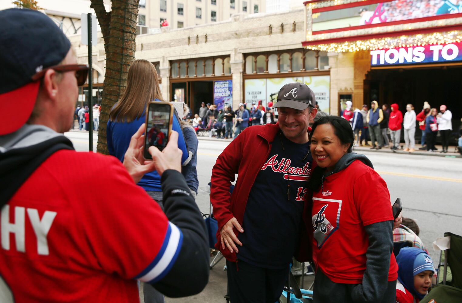 Matthew and Lois Mruz, of Alpharetta, have their photo taken during the Braves' World Series parade in Atlanta, Georgia, on Friday, Nov. 5, 2021. (Photo/Austin Steele for the Atlanta Journal Constitution)