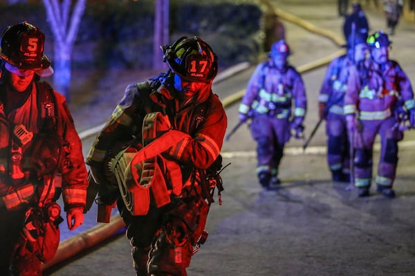 March 15, 2017: Atlanta firefighters made a long walk to the front of the property of the Venetian Hills Apartments, where a fire killed a 63-year-old man. 