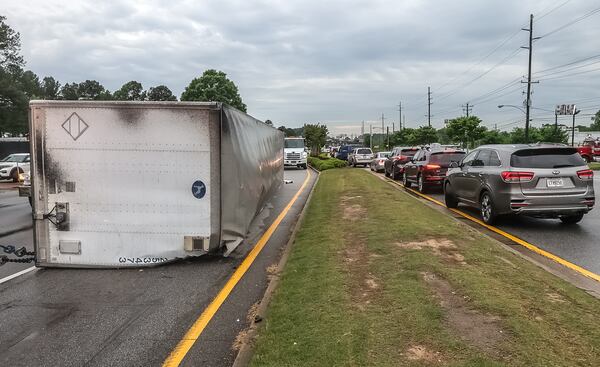 The big rig overturned on Fulton Industrial Boulevard at I-20 early Tuesday morning.