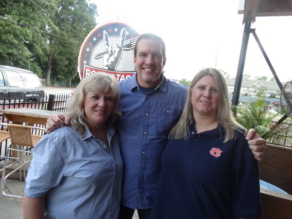 Jennifer and Robyn Davis with "Southside" Steve Rickman after the wedding. CREDIT: Rodney Ho/rho@ajc.com