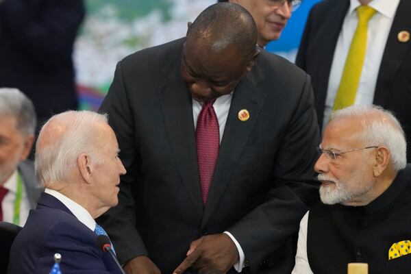 U.S. President Joe Biden, left, South Africa's President Cyril Ramaphosa, center, and India's Prime Minister Narendra Modi talk during the G20 Summit leaders meeting in Rio de Janeiro, Monday, Nov. 18, 2024. (AP Photo/Eraldo Peres)