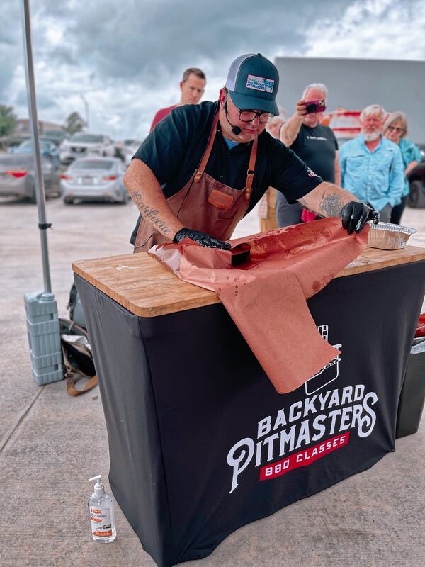 An instructor teaches a Backyard Pitmasters class. (Courtesy of Backyard Pitmasters)