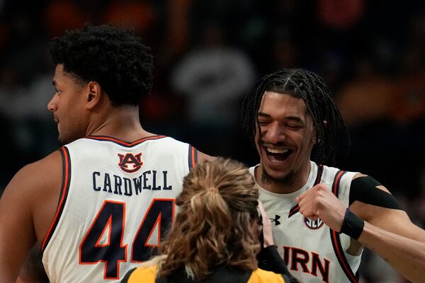 Auburn's Chad Baker-Mazara, right, and Dylan Cardwell, left, celebrate a win against Creighton after the second half in the second round of the NCAA college basketball tournament, Saturday, March 22, 2025, in Lexington, Ky. (AP Photo/Brynn Anderson)