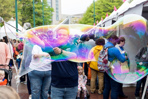 A giant bubble delights visitors at the Atlanta Science Festival's Exploration Expo in Piedmont Park. (Courtesy of Rob Felt 2016)