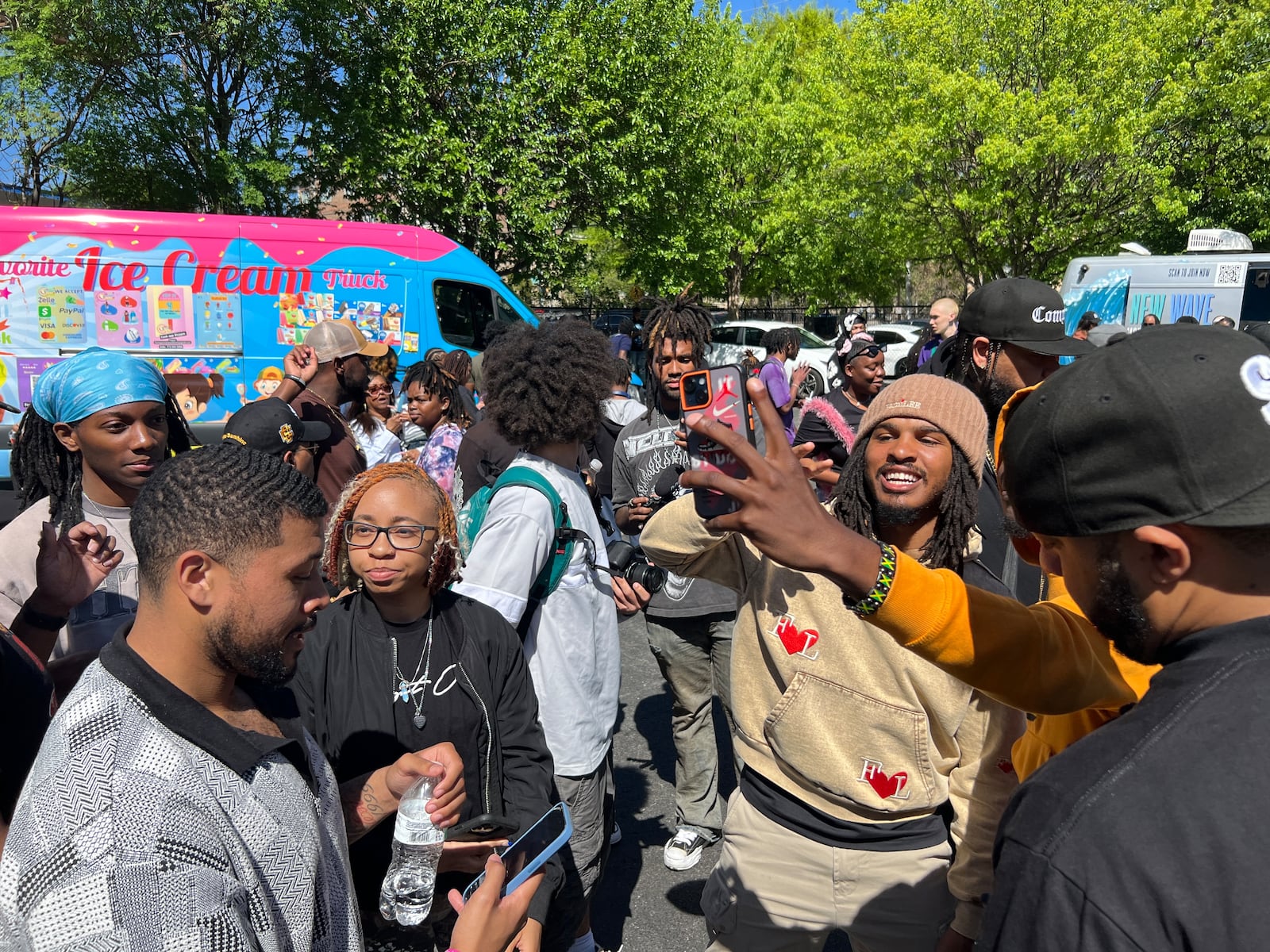 TikTok food critic Keith Lee poses for photos with fans during his "community giveback" event in Atlanta on April 3, 2024. (Mike Jordan/AJC)