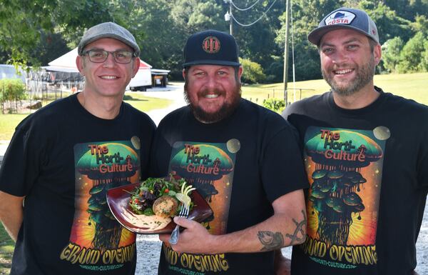 The owners/partners of the Horti-Culture farm in Snellville (from left) Branden Taylor, Bill Corcoran and Austin Taylor are shown with Lion's Mane "Crab" Cakes made with their lion's mane mushrooms. (Styling by Bill Corcoran / Chris Hunt for the AJC)