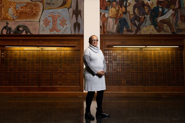 Clark Atlanta Art Museum Director Danille Taylor poses in front of the "Art of the Negro" murals by Hale Woodruff. (Arvin Temkar / arvin.temkar@ajc.com)