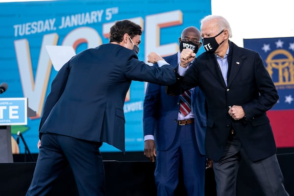 The 2020 election marked a breakthrough for Democrats in Georgia, with Joe Biden, center, becoming the party's first presidential candidate to carry the state in decades. A few weeks later, Democrats Jon Ossoff, left, and Raphael Warnock won runoff elections for the U.S. Senate. (Doug Mills/The New York Times)
                      