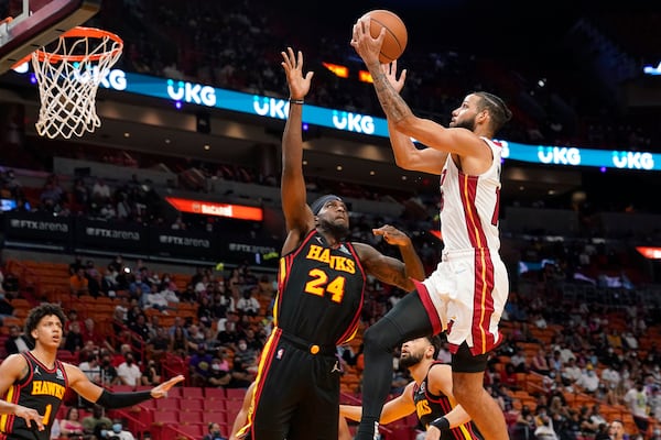 Miami Heat forward Caleb Martin drives to the basket as Hawks center Johnny Hamilton (24) defends during the second half of a preseason NBA game, Monday, Oct. 4, 2021, in Miami. (Marta Lavandier/AP)