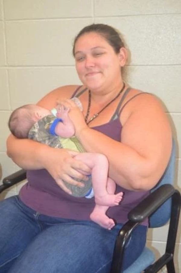 Britney Miller feeds her daughter Rwby at the Salvation Army shelter on West Second Ave. in Albany, Georgia. The baby was born while she and her husband, Justin, were staying at the shelter. (Photo Courtesy of Alan Mauldin)