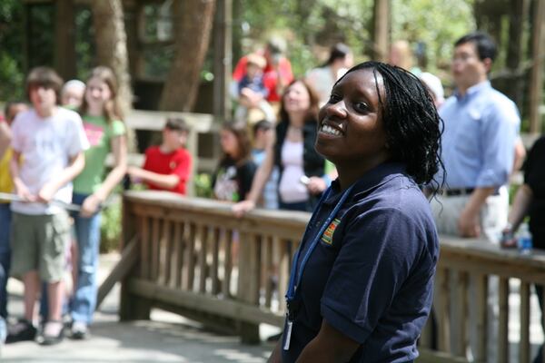 The job fair at Zoo Atlanta will give prospective employees an opportunity to apply for seasonal positions, including work as a rides attendant. Here, a zoo worker helps children at the Safari Slide and rock-climbing wall. Photo: courtesy Zoo Atlanta