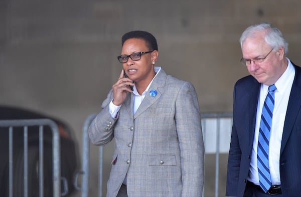 Mitzi Bickers and her attorney Richard Hendrix the Richard B. Russell Federal Building after her first appearance in federal court on April 5, 2018, to face charges that she took $2 million in bribes to steer city of Atlanta contracts to at least two contractors from 2010 to 2015. She has pleaded not guilty. HYOSUB SHIN / HSHIN@AJC.COM