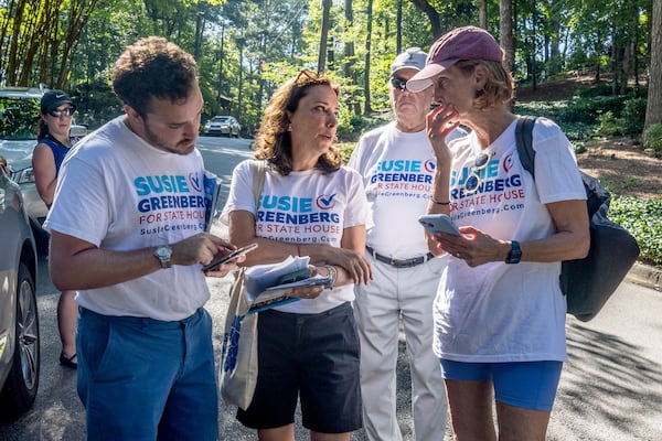 Susie Greenberg, a Democratic candidate for the state House, talks with volunteers Saturday before they spread out around Sandy Springs neighborhoods to speak with voters. (Steve Schaefer / AJC)