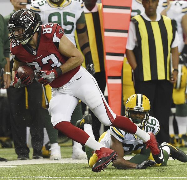 Atlanta Falcons tight end Jacob Tamme (83) runs past Green Bay Packers cornerback LaDarius Gunter (36) during the first of an NFL football game, Sunday, Oct. 30, 2016, in Atlanta. (AP Photo/Rainier Ehrhardt)