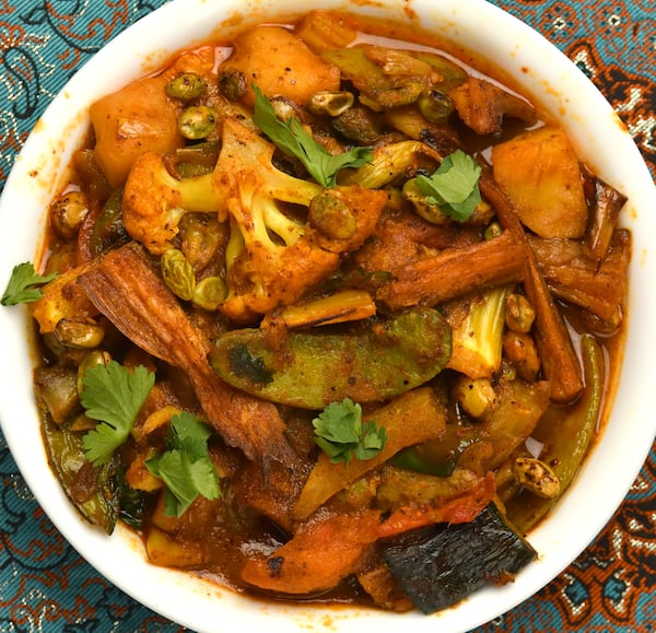 Despite the name, Loitta Shurkir Jhal (Dry Bombay Duck Curry) has fish, not duck. However, the cooked dry Bombay duck is not fishy tasting at all. (Styling by Sukanya Kar Bhowmik / Chris Hunt for the AJC)