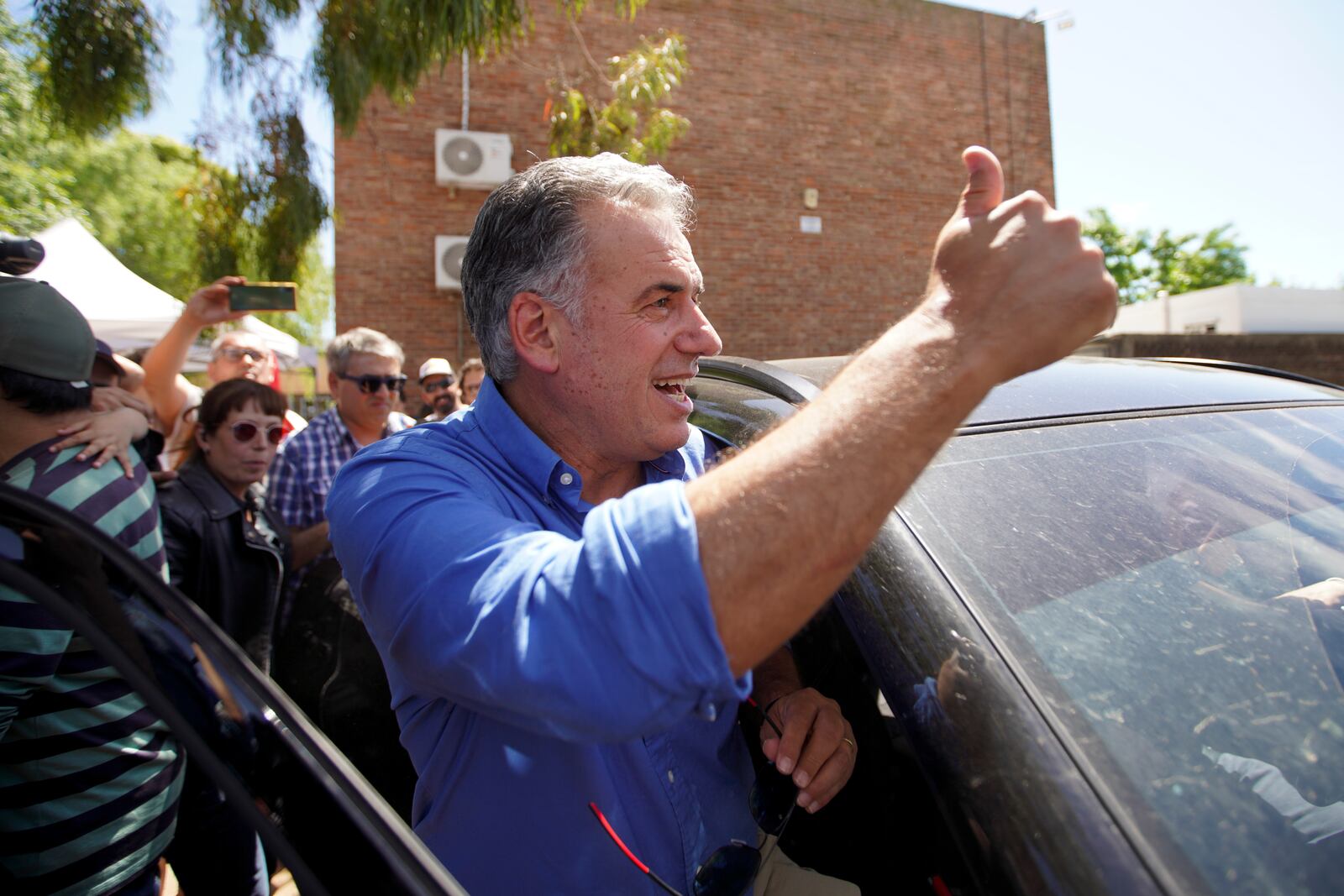 Frente Amplio presidential candidate Yamandu Orsi gets into a car after voting during general elections in Canelones, Uruguay, Sunday, Oct. 27, 2024. (AP Photo/Matilde Campodonico)