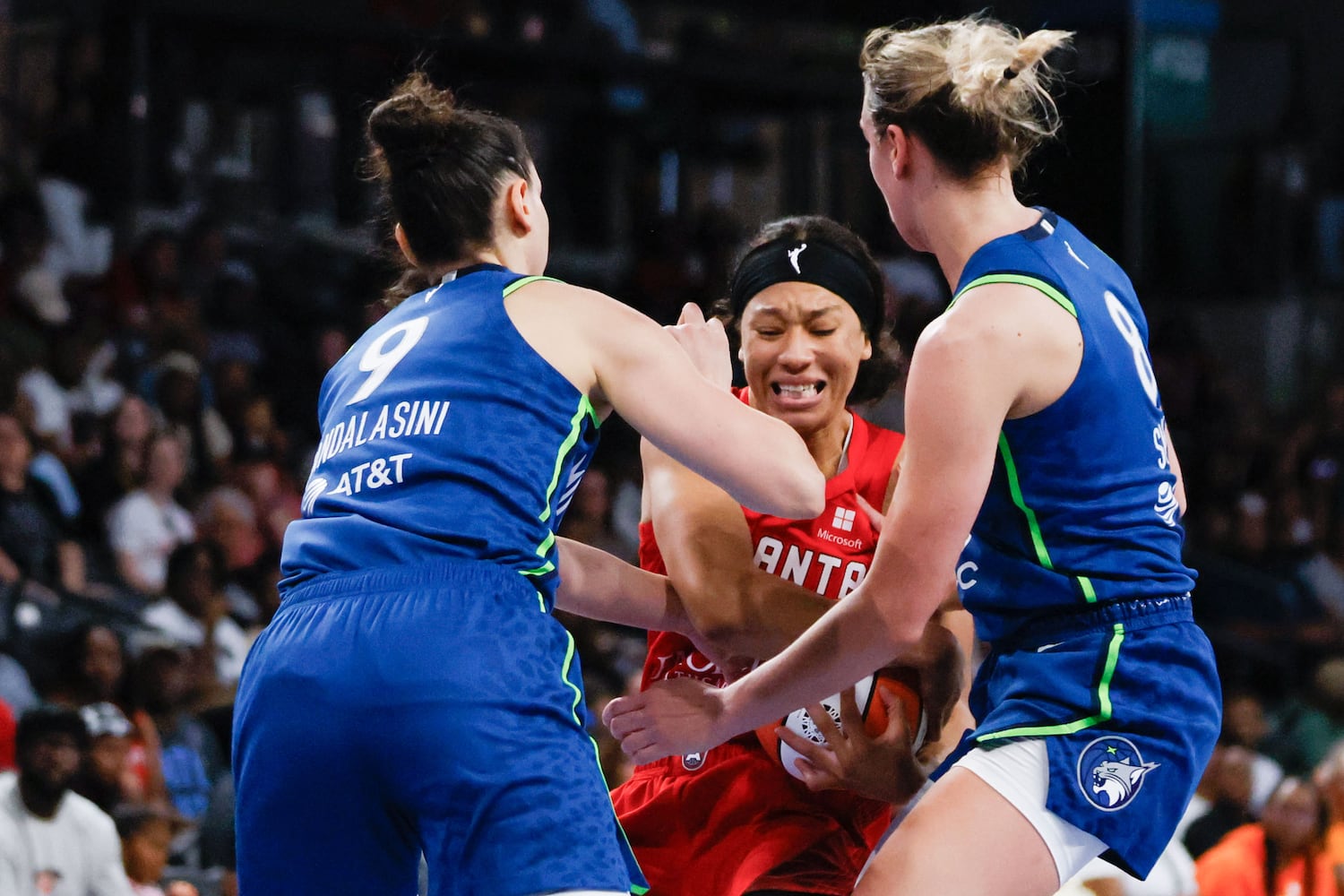 Atlanta Dream guard Aerial Powers (center) fights for the ball against Minnesota Cecilia Zandalasini (left) and Alanna Smith (right) during the second half at Gateway Center Arena, Sunday, May 26, 2024, in Atlanta. (Miguel Martinez / AJC)