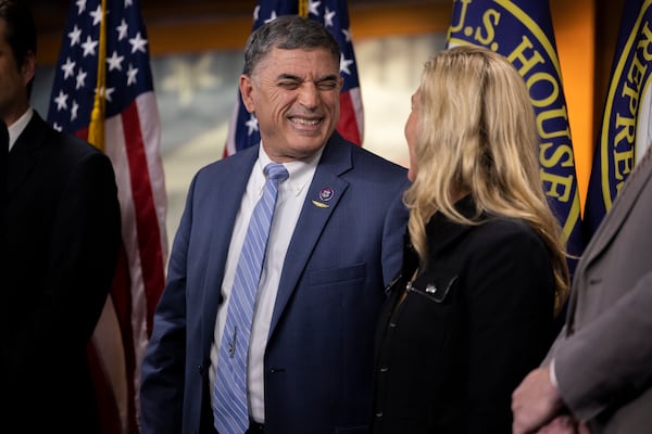 Congressman Andrew Clyde (R-GA) and  Congresswoman marjorie Taylor Greene (R-GA) chat at a press conference on US funding for Ukraine at the U.S. Capitol on November 17th, 2022 in Washington, DC. 