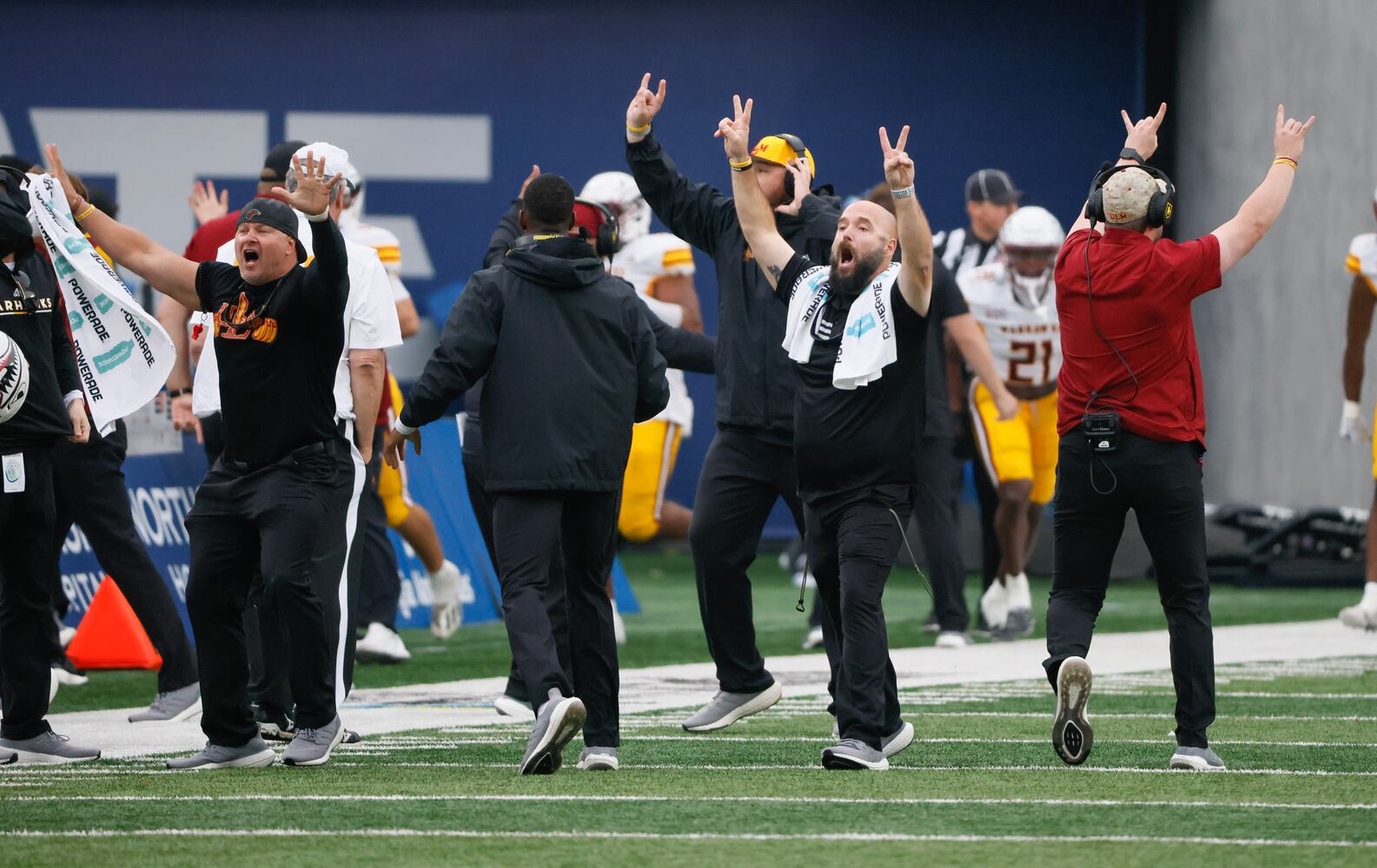 Louisiana-Monroe Warhawks bench celebrates after  linebacker Quae Drake (10) returned a fourth-quarter interception for a touchdown to take the lead. The Warhawks won, 31 - 28.  (Bob Andres for the Atlanta Journal Constitution)