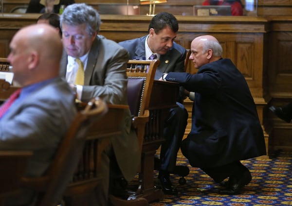 Beach, right, talks with Sen. Steve Gooch, R-Dahlonega, on the third day of the session in the Senate Chambers at the Georgia State Capitol on Jan. 16. Sen. Beach had already started to work the room discussing topics with fellow senators. To read more about the Gold Dome's new freshman class, pick up a copy of Sunday's print AJC or read it on your tablet computer. To subscribe, visit https://ajcdelivers.com/Subscribe.php