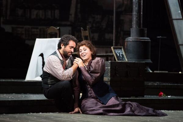 Gianluca Terranova as Rodolfo and Maria Luigia Borsi as Mimi perform in the Atlanta Opera’s production of Giacomo Puccini’s “La Bohème.” The production runs at the Cobb Energy Performing Arts Centre through Oct. 11. CONTRIBUTED BY JEFF ROFFMAN FOR THE ATLANTA OPERA