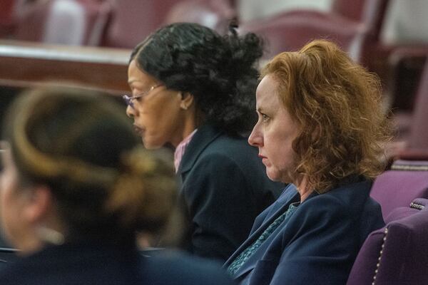 Former Brunswick Judicial Circuit District Attorney Jackie Johnson listens Wednesday, Dec. 11, 2024, at the Glynn County Courthouse in Brunswick, Georgia, prior to a pretrial motions hearing in her violation of oath office case. (Michael Hall/Pool Photo via AP)