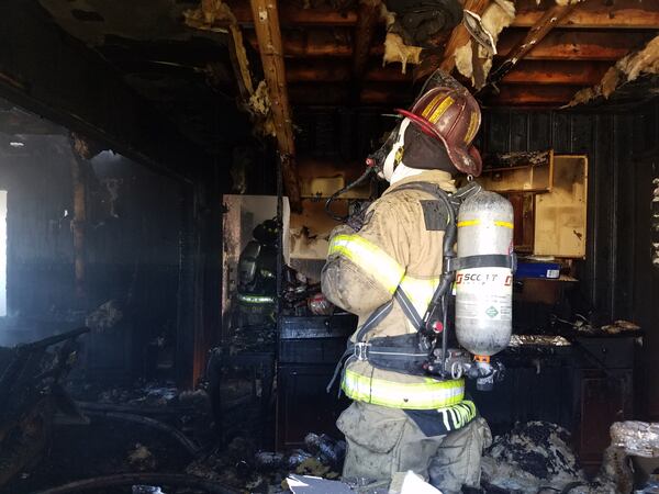 Highway 129 was closed Monday afternoon after two residential fires in Hall County.