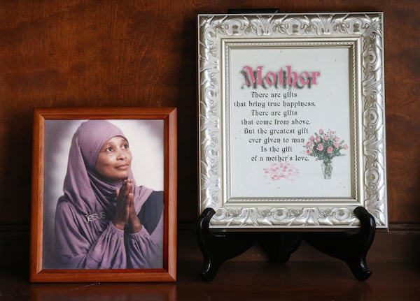 March 15, 2018 North Metro: A picture and tribute to her mother, Anna Elizabeth Young, sits on a shelf in the home of Joy Fluker on Thursday, March 15, 2018, at her home in north metro.   Curtis Compton/ccompton@ajc.com