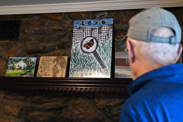 A painting by Joe Eifrid's granddaughter Jess Willadsen, who died in a house fire, is displayed as a reminder of the Rockdale Art Farm's purpose. (Hyosub Shin / AJC)