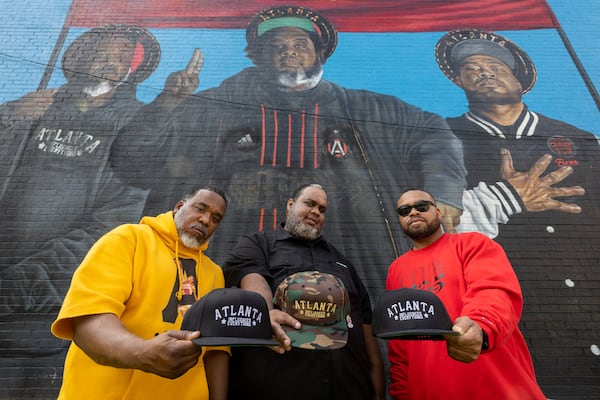 (L-R) Atlanta Influences Everything founders Tory Edwards, Ian Ford and Bem Joiner pose in front of their mural in Atlanta on Tuesday, April 2, 2024. (Arvin Temkar / arvin.temkar@ajc.com)