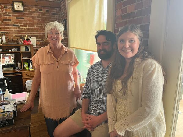 Ellen Harris (left to right) Robert Beverly and Haley Beverly pose for a photo at Plains Historic Inn and Antique Mall during Easter weekend.