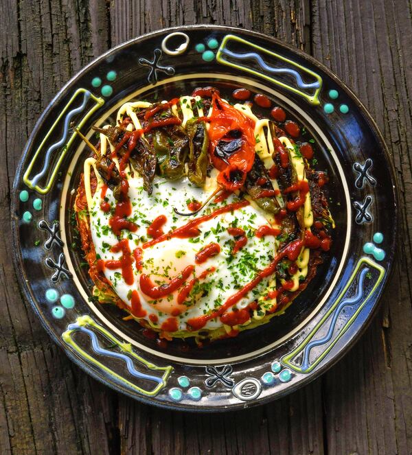 Vegetarian Okonomiyaki. You can put just about anything in the Japanese pancake; we opted for cabbage, carrots, scallions, grated Chinese yam (nagaimo), and Japanese pickled red ginger (beni shoga). We topped it with a fried egg and some charred peppers. It's good plain, too. Food styling by Wendell Brock / Chris Hunt/For The AJC