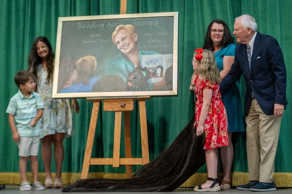 During Monday's dedication ceremony for Sandra Dunagan Deal Elementary School, a portrait of the late first lady is unveiled. 