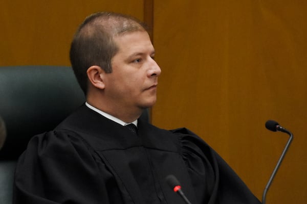 Justice Nels S.D. Peterson listens during oral arguments. (DAVID BARNES / DAVID.BARNES@AJC.COM)