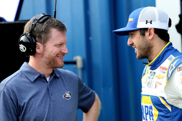 BROOKLYN, MI - AUGUST 11: Chase Elliott, driver of the #9 NAPA Auto Parts Chevrolet, speaks with former NASCAR driver, Dale Earnhardt Jr., during practice for the Monster Energy NASCAR Cup Series Consmers Energy 400 at Michigan International Speedway on August 11, 2018 in Brooklyn, Michigan.  (Photo by Jerry Markland/Getty Images)