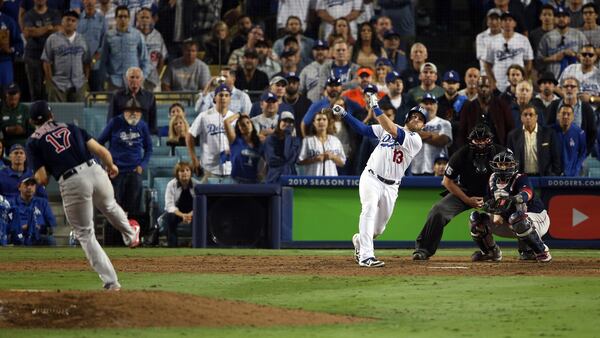 Dodgers' Max Muncy hits a walk-off home run in the 18th inning to beat the Boston Red Sox in Game 3 of the 2018 World Series Friday, Oct. 26, 2018, at Dodger Stadium in Los Angeles.