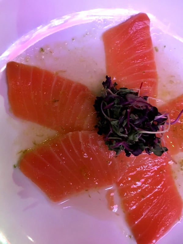 The salmon carpaccio is a simple dish finished with lemon zest and micro greens at Co. CONTRIBUTED BY WYATT WILLIAMS