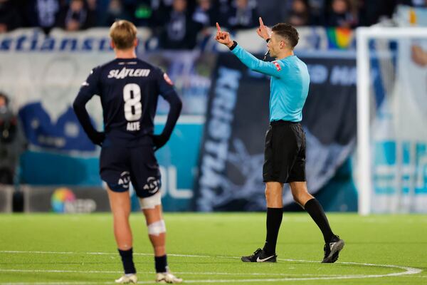 FILE - Referee Tore Hansen checks VAR during the football match between Kristiansund and Viking at Nordmore Stadium, Kristiansund, Norway, Nov. 10, 2024. (Svein Ove Ekornesvag/NTB via AP, file)