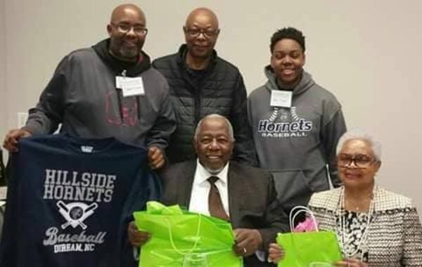 Delbert Jarmon, along with Herb Sellers, and Jarmon's son Mason Pickett at Duke University with Hank and Billye Aaron.