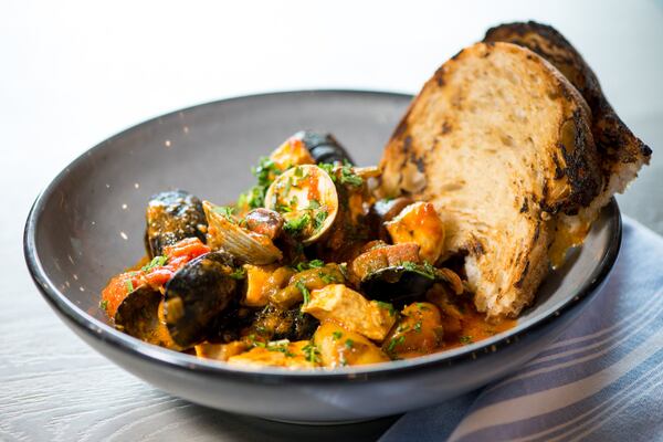  Portuguese fish stew entree with fish, clams, mussels, Heywood’s chorizo, peppers, tomatoes and saffron. Photo credit- Mia Yakel.