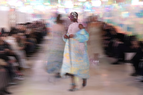 A model wears a creation as part of the Susan Fang Fall/Winter 2025-2026 Women's collection presented in Milan, Italy, Sunday, March 2, 2025. (AP Photo/Antonio Calanni)