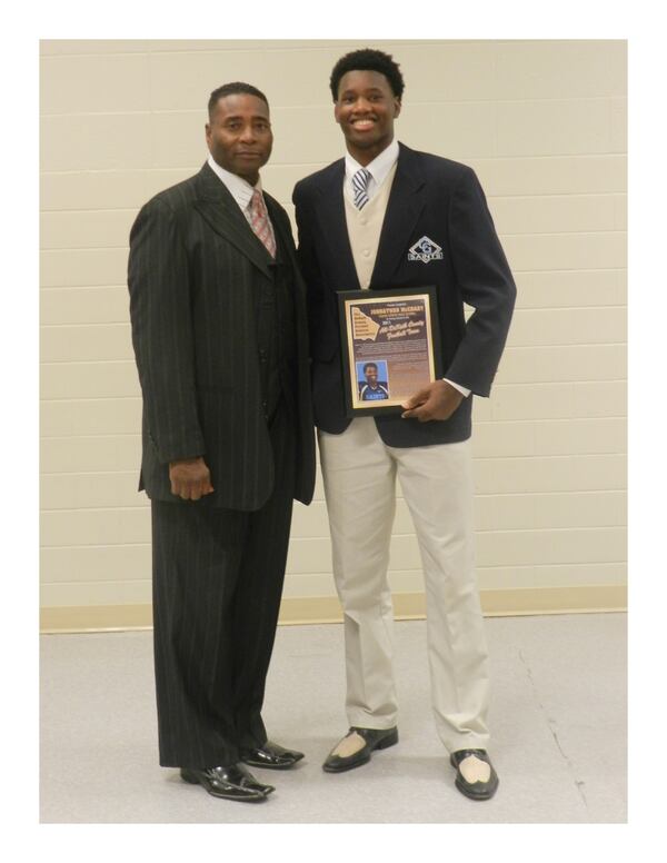 As a senior at Cedar Grove High, Johnny McCrary poses with his father, Greg McCrary. (Photo from McCrary family)