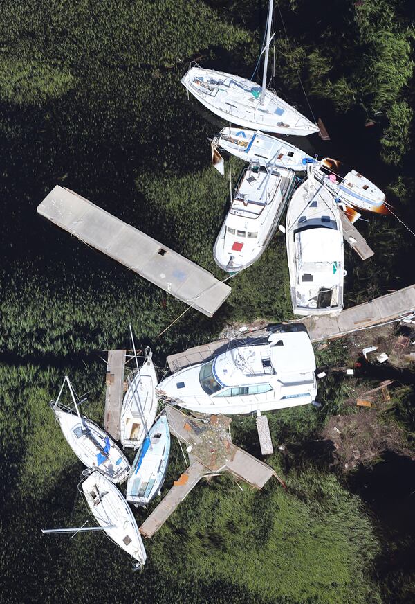  Boats blown away from their docks sit in the marsh after Hurricane Irma on Tuesday, September 12, 2017, at St. Marys on the Georgia coast. (Curtis Compton/ccompton@ajc.com)