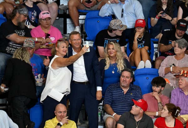 Former Rep Doug Collins poses with a supporter ahead of the rally for Former President Donald Trump and Vice-Presidential candidate JD Vance at the Georgia State University’s convocation center on Saturday, August 3, 2024 in Atlanta. Former President Donald Trump and Vice-Presidential candidate JD Vance are holding their first rally together in Georgia on Saturday at the same place – the GSU Convocation Center- Kamala Harris held hers earlier this week. (Hyosub Shin / AJC)