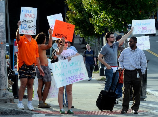 091021 Atlanta--Protesters stand, some in their underwear, at the intersection of 10th Street and Piedmont Avenue in Atlanta, Ga Wednesday, Oct 21, 2009 to make a statement about the recent raids at the Eagle club. "Out of 62 people that were in the bar harassed,we probably have 15 people who have come forward, because they are scared," Robert Kelley, an owner of the Eagle who was also in his underwear, said. "They don't need to be afraid. We didn't do anything wrong, the police did." Elissa Eubanks, eeubanks@ajc.com