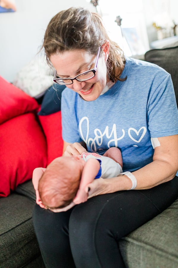 Sabrina holds Harrison for the first time April 9, the day she came home from the hospital after a 42-day stay. She held Harrison after a long-awaited reunion with her older son, which included 
a lot of hugs, kisses and tears on her front walkway.