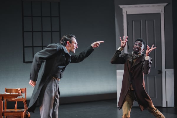 Christian Clark (left) as Scrooge berates the hard-working Bob Cratchit (Darvensky Louis) in this dramatic dance film. (Photos by Christina Massad)