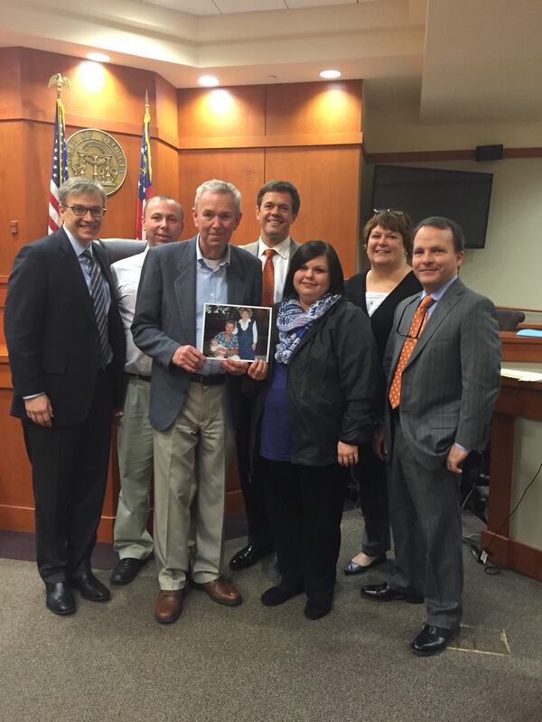 From left, attorney Marc Howard, Patrick Davis (son), Johnny Davis (husband), attorney Geoffrey Pope, Brandi Davis (daughter), paralegal Karen Wayman and attorney Darren Summerville.