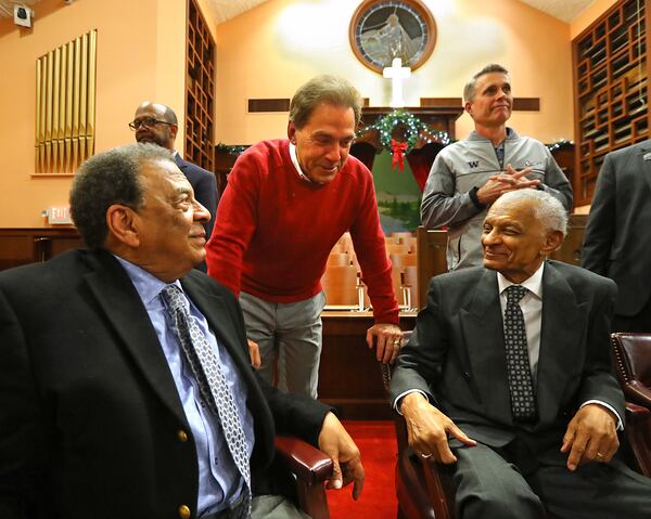 Alabama head football coach Nick Saban and Washington head football coach Chris Petersen greet Ambassador Andrew Young (seated left) and the Rev. C.T. Vivian at the conclusion of a Chick-fil-A Peach Bowl tour of the Martin Luther King Jr. National Historic Site to hear first-hand accounts from the Civil Rights leaders at the Historic Ebenezer First Baptist Church on Tuesday, Dec. 27, 2016, in Atlanta.  Curtis Compton/ccompton@ajc.com